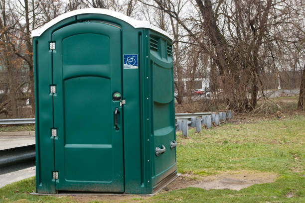 Portable restroom units arranged on grass in Mecklenburg County