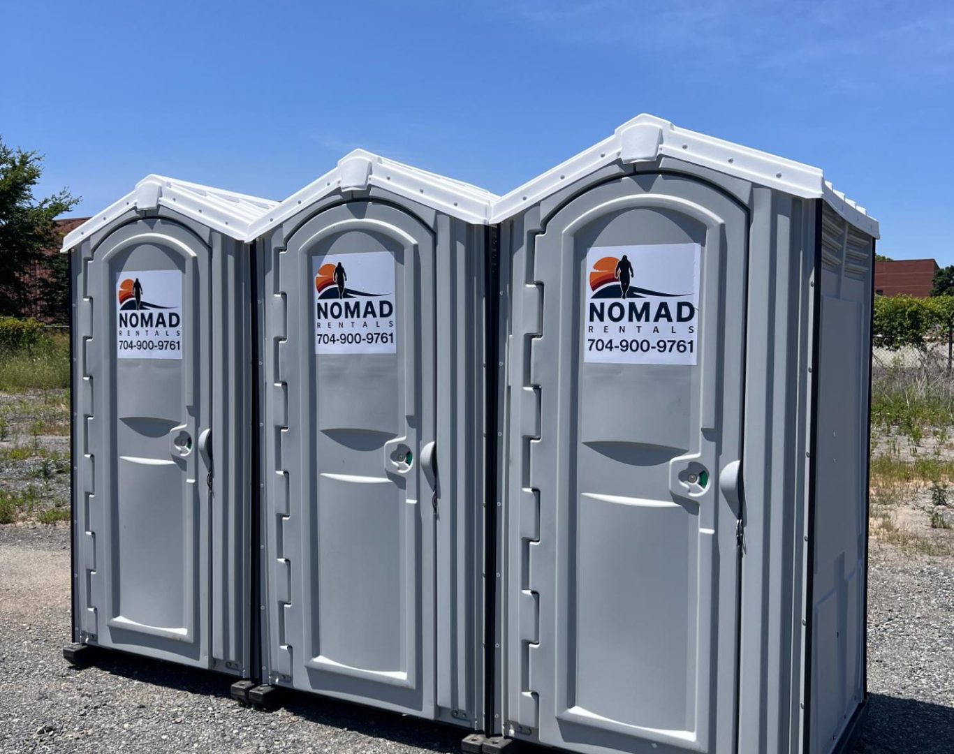 Outdoor portable toilets by Nomad Rentals