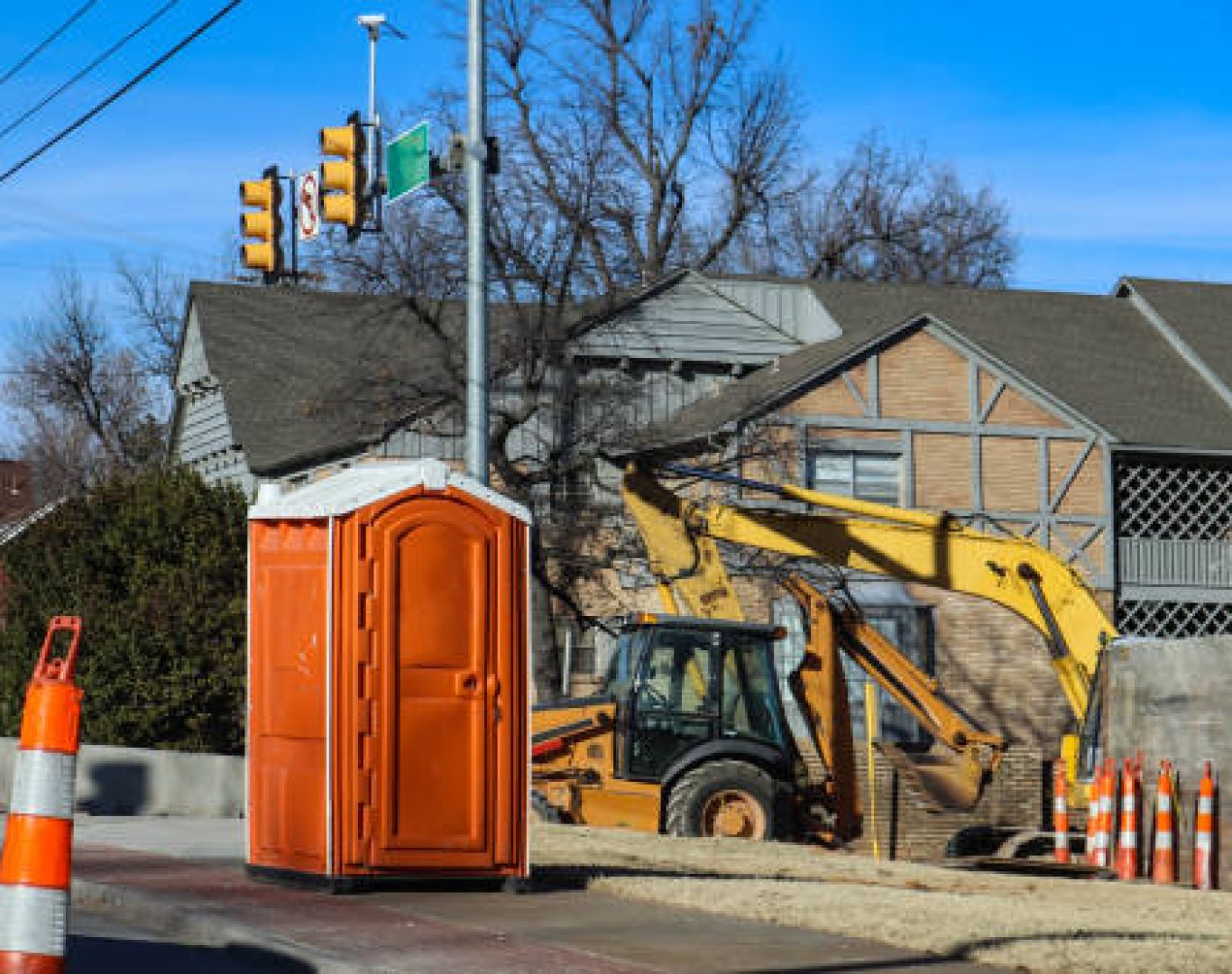 Nomad Rentals servicing portable construction toilets to maintain sanitary conditions.