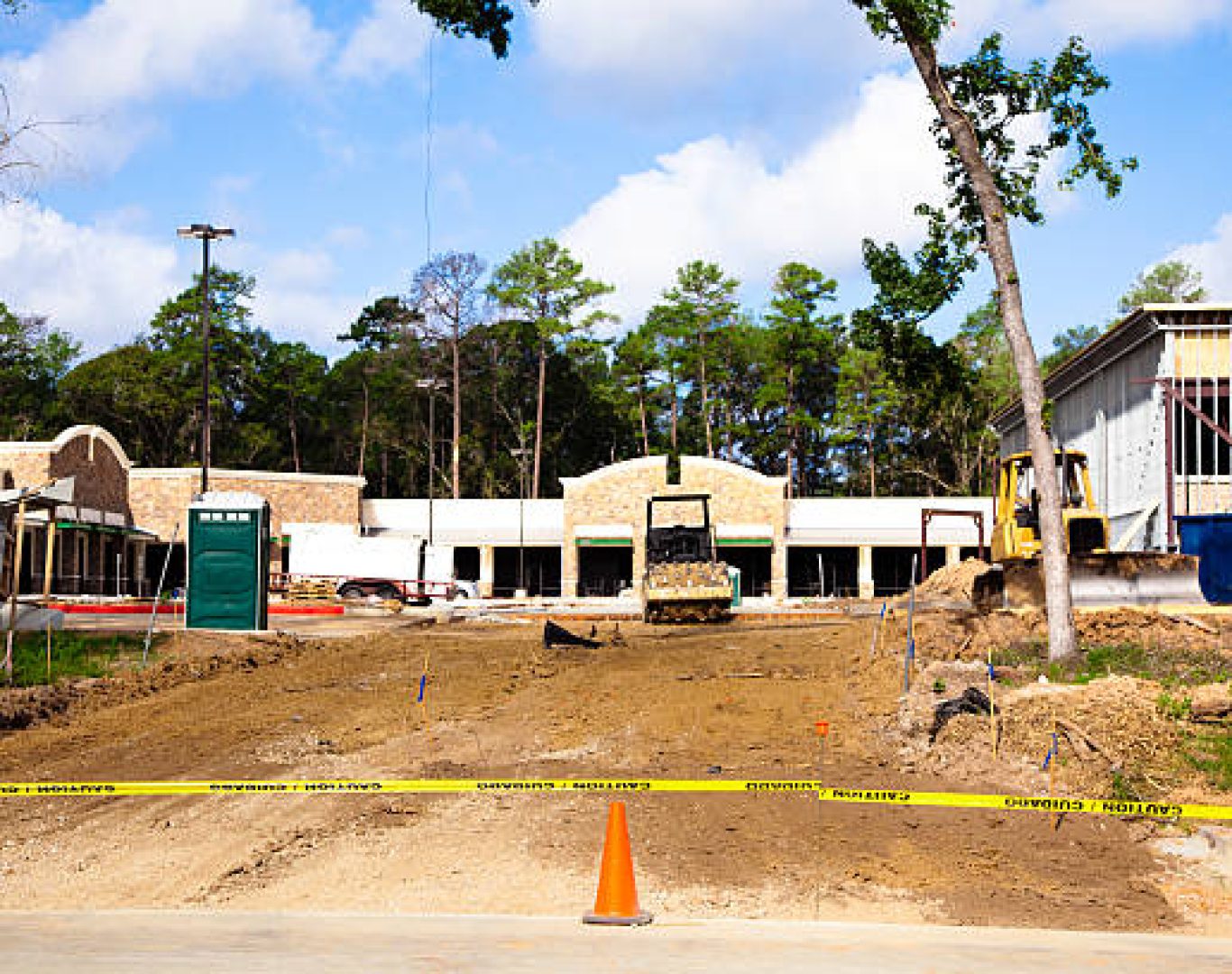 Clean construction toilets from Nomad Rentals set up for worker convenience.